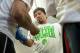 HOLLYWOOD, CA - APRIL 2: Boxer Manny Pacquiao puts on his gloves during the media day workout at the Wild Card Boxing Gym on April 2, 2014 in Hollywood, California (Photo by Alexis Cuarezma/Getty Images)