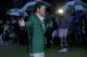 Adam Scott, of Australia, celebrates with his green jacket after winning the Masters golf tournament Sunday, April 14, 2013, in Augusta, Ga. (AP Photo/Charlie Riedel)