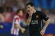 Barcelona's Lionel Messi from Argentina gestures during the Champions League quarterfinal second leg soccer match between Atletico Madrid and FC Barcelona at the Vicente Calderon stadium in Madrid, Spain, Wednesday, April 9, 2014. (AP Photo/Andres Kudacki)