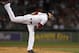 Boston Red Sox's Clay Buchholz follows through on a pitch against the New York Yankees in the first inning of a baseball game at Fenway Park, in Boston, Sunday, Sept. 15, 2013. (AP Photo/Steven Senne)