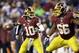 Washington Redskins quarterback Robert Griffin III (10) looks to pass with the protection of guard Chris Chester (66) during the first half of an NFL football game against the New York Giants Sunday, Dec. 1, 2013, in Landover, Md. (AP Photo/Patrick Semansky)