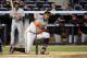 Baltimore Orioles' Adam Jones reacts after striking out during the ninth inning of a baseball game against the New York Yankees Wednesday, April 9, 2014, at Yankee Stadium in New York. (AP Photo/Bill Kostroun)