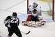 Pittsburgh Penguins' Lee Stempniak (22) puts the puck behind Chicago Blackhawks goalie Corey Crawford (50) for a goal in the first period of an NHL hockey game in Pittsburgh, Sunday, March 30, 2014. (AP Photo/Gene J. Puskar)