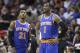 New York Knicks guard Iman Shumpert (21) and forward Amar'e Stoudemire (1) look on during the second half of an NBA basketball game against the Miami Heat, Sunday, April 6, 2014 in Miami. The Heat defeated the Knicks 102-91. (AP Photo/Wilfredo Lee)