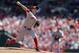 Cincinnati Reds starting pitcher Mike Leake throws during the first inning of a baseball game against the St. Louis Cardinals Wednesday, April 9, 2014, in St. Louis. (AP Photo/Jeff Roberson)