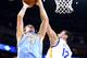 OAKLAND, CA - APRIL 10: Timofey Mozgov #25 of the Denver Nuggets rebounds against Draymond Green #23 of the Golden State Warriors on April 10, 2014 at Oracle Arena in Oakland, California. NOTE TO USER: User expressly acknowledges and agrees that, by downloading and or using this photograph, user is consenting to the terms and conditions of Getty Images License Agreement. Mandatory Copyright Notice: Copyright 2014 NBAE (Photo by Rocky Widner/NBAE via Getty Images)
