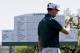 Adam Scott, of Australia, lines up his putt on the 18th green during the first round of the Masters golf tournament Thursday, April 10, 2014, in Augusta, Ga. (AP Photo/David J. Phillip)