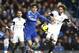 Chelsea's Oscar, left, of Brazil, controls the ball as Swansea City's Jose Canas, right, tries to stop him during an English Premier League soccer match against Swansea City at the Stamford Bridge ground in London, Thursday, Dec. 26, 2013. Chelsea won the match 1-0.(AP Photo/Lefteris Pitarakis)