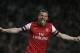 Arsenal's Lukas Podolski celebrates after scoring a goal against Wigan Athletic during their English Premier League soccer match at Arsenal's Emirates stadium in London, Tuesday, May 14, 2013. (AP Photo/Alastair Grant)