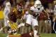 Texas running back Joe Bergeron (24) runs over Iowa State defensive back Sam E. Richardson during the second half of an NCAA college football game on Thursday, Oct. 3, 2013, in Ames, Iowa. Texas won 31-30. (AP Photo/Charlie Neibergall)