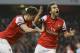 Arsenal's Mathieu Flamini, right, celebrates scoring a goal with Olivier Giroud during the English Premier League soccer match between Arsenal and Manchester City at the Emirates stadium in London, Saturday, March 29, 2014. (AP Photo/Kirsty Wigglesworth)