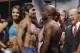 Manny Pacquiao, left, and Timothy Bradley pose for photos following a weigh-in for their WBO welterweight championship boxing match Friday, April 11, 2014, in Las Vegas. (AP Photo/Isaac Brekken)
