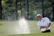 Fred Couples blasts out of a bunker on the 17th fairway during the second round of the Masters golf tournament Friday, April 11, 2014, in Augusta, Ga. (AP Photo/Matt Slocum)