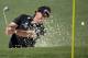 Phil Mickelson hits out of a bunker on the second hole during the first round of the Masters golf tournament Thursday, April 10, 2014, in Augusta, Ga. (AP Photo/Chris Carlson)