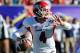 Fresno State quarterback Derek Carr looks to throw the ball against Southern California during the second quarter of the Royal Purple Bowl NCAA college football game, Saturday, Dec. 21, 2013, in Las Vegas. (AP Photo/David Cleveland)