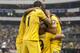 America's Raul Jimenez, , bottom center celebrates after scoring against Tigres during a Mexican soccer league match in Mexico City, Sunday, Dec. 1, 2013. (AP Photo/Christian Palma)