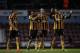 Hull City's, from left, Jake Livermore, Ahmed Elmohamady, David Meyler and Curtis Davies walk off the pitch together after being defeated 2-1 at the end of the English Premier League soccer match between West Ham and Hull City at Upton Park stadium in London, Wednesday, March 26, 2014. (AP Photo/Matt Dunham)