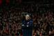 Arsenal's French manager Arsene Wenger stands with his arms folded during the English Premier League soccer match between Arsenal and Swansea City at the Emirates Stadium in London, Tuesday, March 25, 2014. (AP Photo/Matt Dunham)