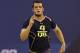 Fresno State quarterback Derek Carr runs a drill at the NFL football scouting combine in Indianapolis, Sunday, Feb. 23, 2014. (AP Photo/Nam Y. Huh)
