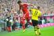 Bayern's Mario Mandzukic of Croatia, left, and Dortmund's Marco Reus challenge for the ball during the Bundesliga soccer match between FC Bayern Munich and Borussia Dortmund in Munich, Germany, on Saturday, April 12 2014. (AP Photo/Kerstin Joensson)