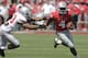 Ohio State running back Curtis Samuel, right, runs around the outside as linebacker Darron Lee defends during their spring NCAA college football game Saturday, April 12, 2014, in Columbus, Ohio. (AP Photo/Jay LaPrete)
