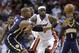 Miami Heat's LeBron James, middle, and Indiana Pacers' David West (21) watch the ball get away during the first half of an NBA basketball game, Friday, April 11, 2014, in Miami. (AP Photo/Lynne Sladky)