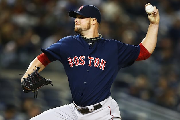 LESTER REMAINS OPTIMISTIC of STAYING with RED SOX