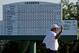 Fred Couples holds up his ball on the 18th green after his third round of the Masters golf tournament Saturday, April 12, 2014, in Augusta, Ga. (AP Photo/Matt Slocum)
