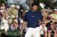Bubba Watson tips his cap after putting on the 18th green during the third round of the Masters golf tournament Saturday, April 12, 2014, in Augusta, Ga. (AP Photo/Charlie Riedel)