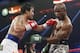 Manny Pacquiao, left, of the Philippines, throws a left at Timothy Bradley during the WBO welterweight title boxing bout Saturday, April 12, 2014, in Las Vegas. (AP Photo/Eric Jamison)