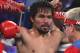 Manny Pacquiao, of the Philippines, sits in his corner between rounds of his WBO welterweight title boxing fight against Timothy Bradley Saturday, April 12, 2014, in Las Vegas. (AP Photo/Isaac Brekken)