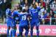 SWANSEA, WALES - APRIL 13: Demba Ba #19 of Chelsea is congratulated by teammates after scoring the opening goal during the Barclays Premier League match between Swansea City and Chelsea at Liberty Stadium on April 13, 2014 in Swansea, Wales. (Photo by Michael Steele/Getty Images)