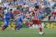 Atletico's Diego Costa, right, misses a penalty kick during a Spanish La Liga soccer match between Getafe and Atletico Madrid at the Coliseum Alfonso Perez stadium in Madrid, Spain, Sunday, April 13, 2014. (AP Photo/Andres Kudacki)