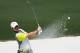 Rory McIlroy, of Northern Ireland, hits out of a bunker on the second hole during the fourth round of the Masters golf tournament Sunday, April 13, 2014, in Augusta, Ga. (AP Photo/Matt Slocum)