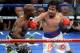 Apr 12, 2014; Las Vegas, NV, USA; Timothy Bradley (green gloves) and Manny Pacquiao (red gloves) box during their WBO World Welterweight Title bout at MGM Grand Garden Arena. Pacquiao won via unanimous decision. Mandatory Credit: Joe Camporeale-USA TODAY Sports