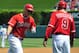 April 13, 2014; Anaheim, CA, USA; Los Angeles Angels center fielder Mike Trout (27) is congratulated by third base coach Gary DiSarcina (9) after hitting a solo home run in the first inning against the New York Mets at Angel Stadium of Anaheim. Mandatory Credit: Gary A. Vasquez-USA TODAY Sports
