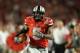 Jan 3, 2014; Miami Gardens, FL, USA; Ohio State Buckeyes quarterback Braxton Miller (5) runs for a touchdown in the first half against the Clemson Tigers during the 2014 Orange Bowl college football game at Sun Life Stadium. Mandatory Credit: Steve Mitchell-USA TODAY Sports