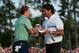 AUGUSTA, GA - APRIL 13: Bubba Watson of the United States shakes hands with Jordan Spieth on the 18th green after Watson won the 2014 Masters Tournament by a three-stroke margin at Augusta National Golf Club on April 13, 2014 in Augusta, Georgia. (Photo by Andrew Redington/Getty Images)