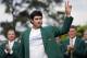 Bubba Watson waves after being presented with his green jacket after winning the Masters golf tournament Sunday, April 13, 2014, in Augusta, Ga. (AP Photo/David J. Phillip)