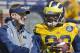 Michigan offensive coordinator Doug Nussmeier, left, laughs with quarterback Devin Gardner (98) during the NCAA college football team's annual spring game on Saturday, April 5, 2014, in Ann Arbor, Mich. (AP Photo/Tony Ding)