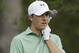 Jordan Spieth clutches his club after his approach shot on the eighth hole during the fourth round of the Masters golf tournament Sunday, April 13, 2014, in Augusta, Ga. (AP Photo/David J. Phillip)