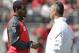 Ohio State quarterback Braxton Miller, left, talks with head coach Urban Meyer during their spring NCAA college football game Saturday, April 12, 2014, in Columbus, Ohio. (AP Photo/Jay LaPrete)