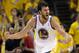 FILE - In this May 2, 2013 file photo, Golden State Warriors' Andrew Bogut celebrates scoring against the Denver Nuggets during an NBA basketball game in Oakland, Calif. Bogut says he is