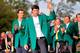 AUGUSTA, GA - APRIL 13: Bubba Watson of the United States poses with the green jacket after winning the 2014 Masters Tournament by a three-stroke margin as Adam Scott of Australia looks on at Augusta National Golf Club on April 13, 2014 in Augusta, Georgia. (Photo by Rob Carr/Getty Images)