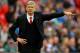 LONDON, ENGLAND - APRIL 12: Arsene Wenger, manager of Arsenal signals during the FA Cup Semi-Final match between Wigan Athletic and Arsenal at Wembley Stadium on April 12, 2014 in London, England. (Photo by Mike Hewitt/Getty Images)