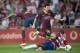 Barcelona's Lionel Messi from Argentina, center, in action with Granada's Allan Romero Nyom from France during a Spanish La Liga soccer match between FC Granada and FC Barcelona at Los Carmenes stadium in Granada, Spain, Saturday, April 12, 2014. (AP Photo/Daniel Tejedor)