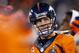 Denver Broncos' Peyton Manning looks at the scoreboard during the second half of the NFL Super Bowl XLVIII football game against the Seattle Seahawks on Sunday, Feb. 2, 2014, in East Rutherford, N.J. (AP Photo/Paul Sancya)