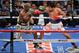 Timothy Bradley, left, and Manny Pacquiao, of the Philippines, trade blows in their WBO welterweight title boxing fight Saturday, April 12, 2014, in Las Vegas. (AP Photo/Isaac Brekken)
