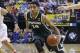 Michigan State guard Gary Harris drives the ball in the first half of an NCAA college basketball game against Wisconsin in the semifinals of the Big Ten Conference tournament Saturday, March 15, 2014, in Indianapolis. (AP Photo/Michael Conroy)