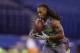 Louisville defensive back Calvin Pryor runs a drill at the NFL football scouting combine in Indianapolis, Tuesday, Feb. 25, 2014. (AP Photo/Michael Conroy)
